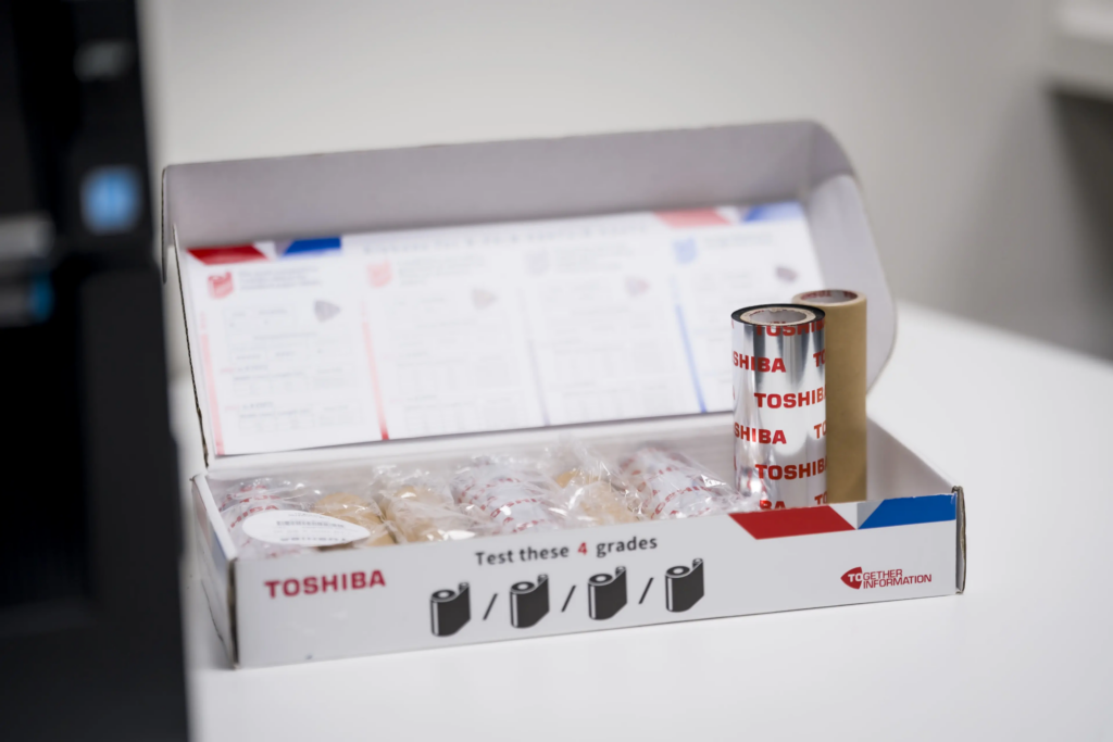 Printing rolls and consumables presented in a box for traceability equipment.
